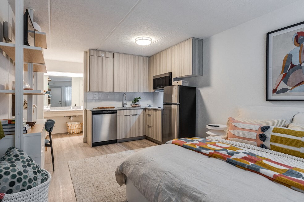a studio apartment with a bed and a kitchen at The Teale, Kissimmee, FL, 34746