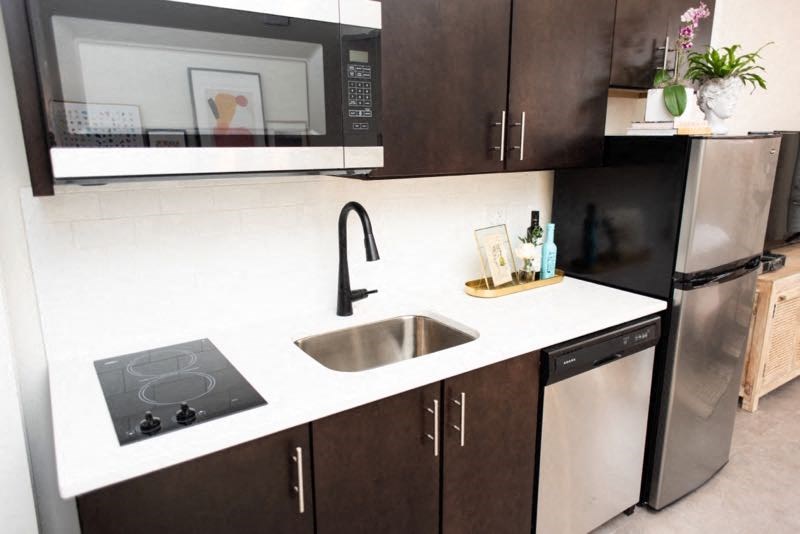 a kitchen with a sink and a microwave