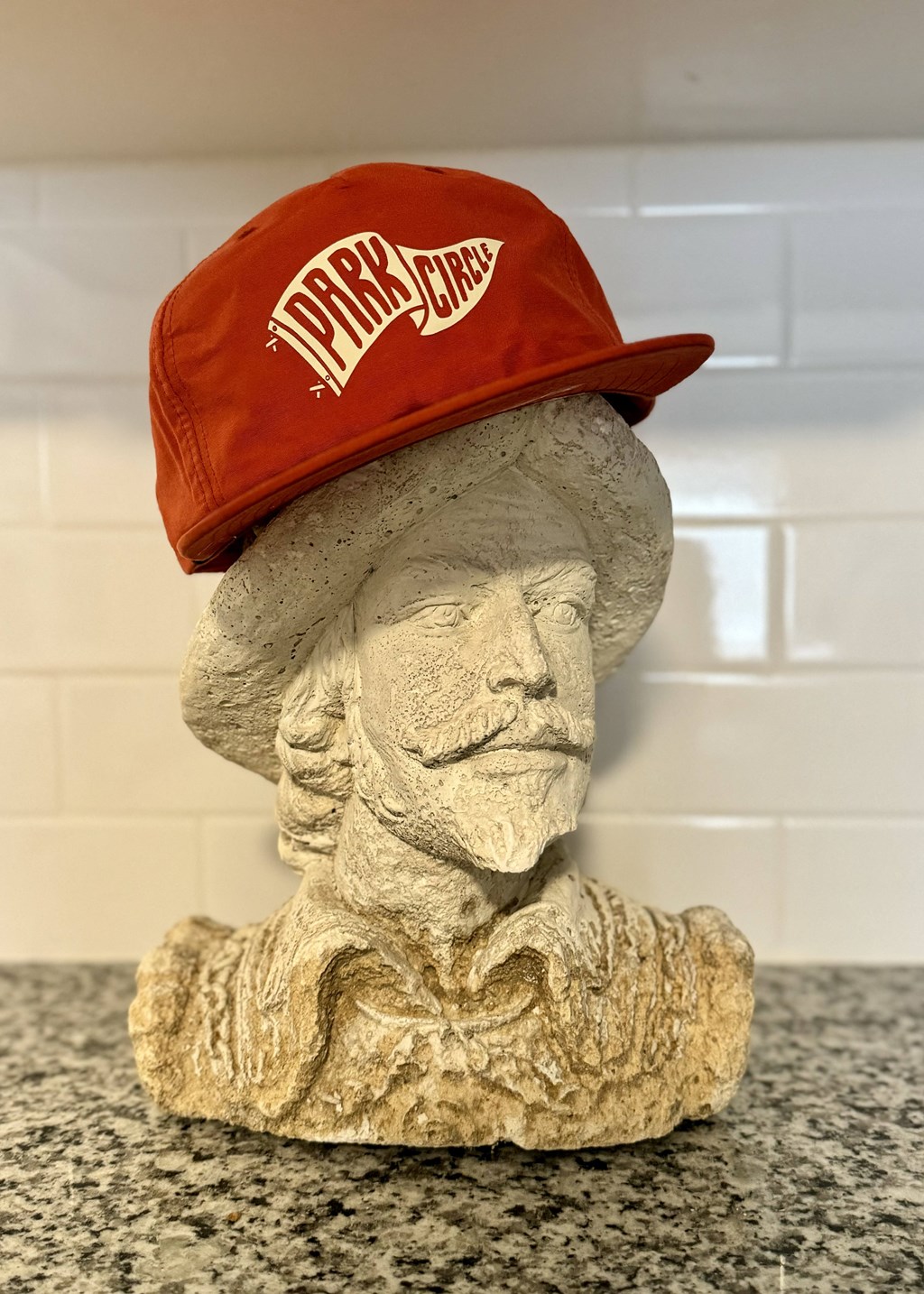 a statue of a baseball player with a hat on it at The Teale Navy Yard, North Charleston, 29405
