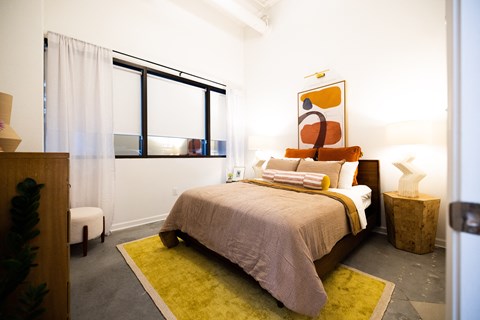 a bedroom with a bed and a large window  at The Lady, Columbia, SC, 29201