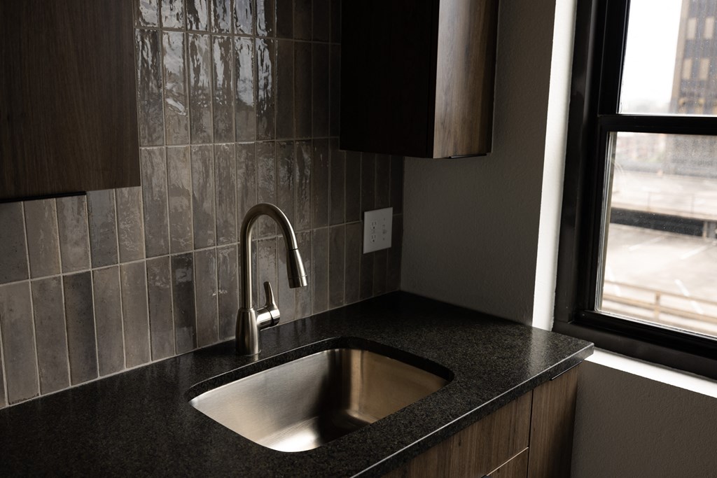 a kitchen with a sink and a window  at The Lady, South Carolina