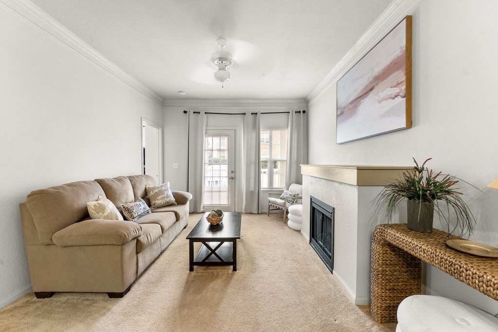 a living room with a couch and a fireplace