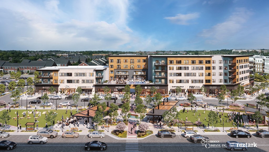 A rendering of a future town square with a large building in the background at The District at Deerfield Residences Apartments, Mason, OH
