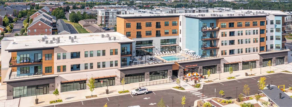 A large building with a pool in the middle of it.