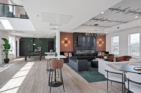 A modern living room with a fireplace and a television.