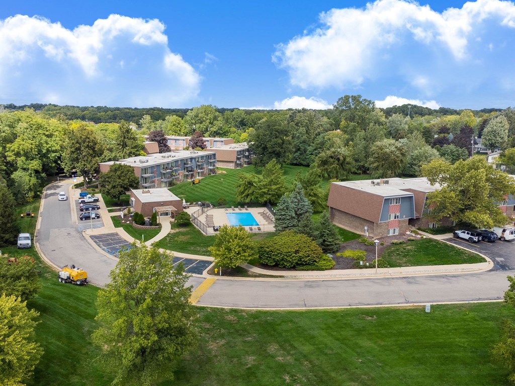A large building with a parking lot in front of it.