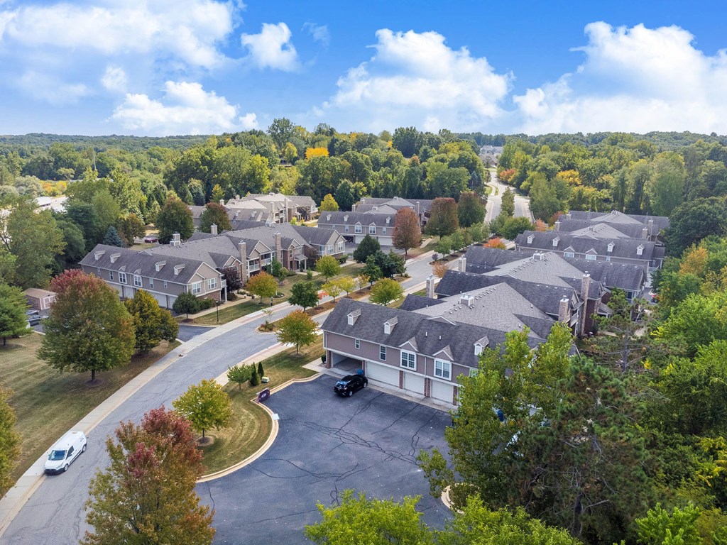 A residential area with houses and trees.
