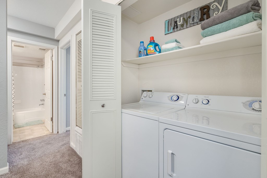 A laundry room with a washer and dryer.