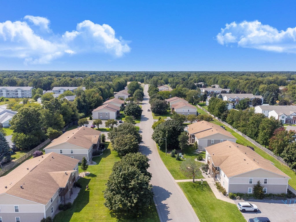 A residential area with houses and trees.