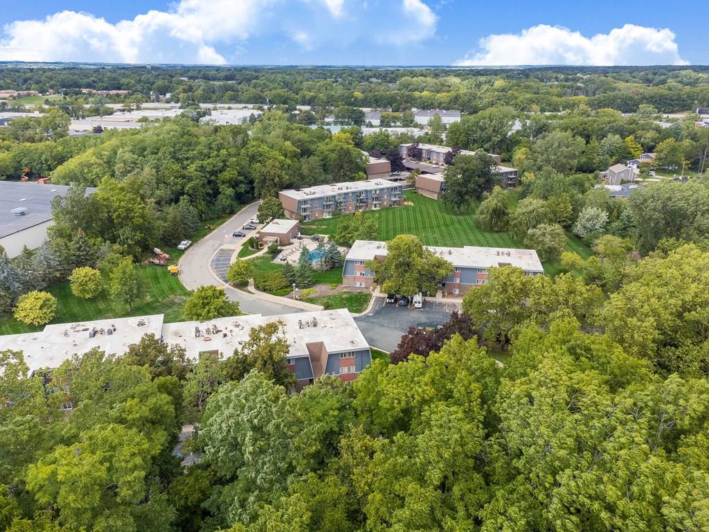 A bird's eye view of a campus with buildings and trees.