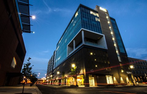 a night view of a tall building on a city street