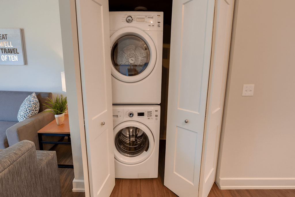 A washing machine and dryer in a small room.