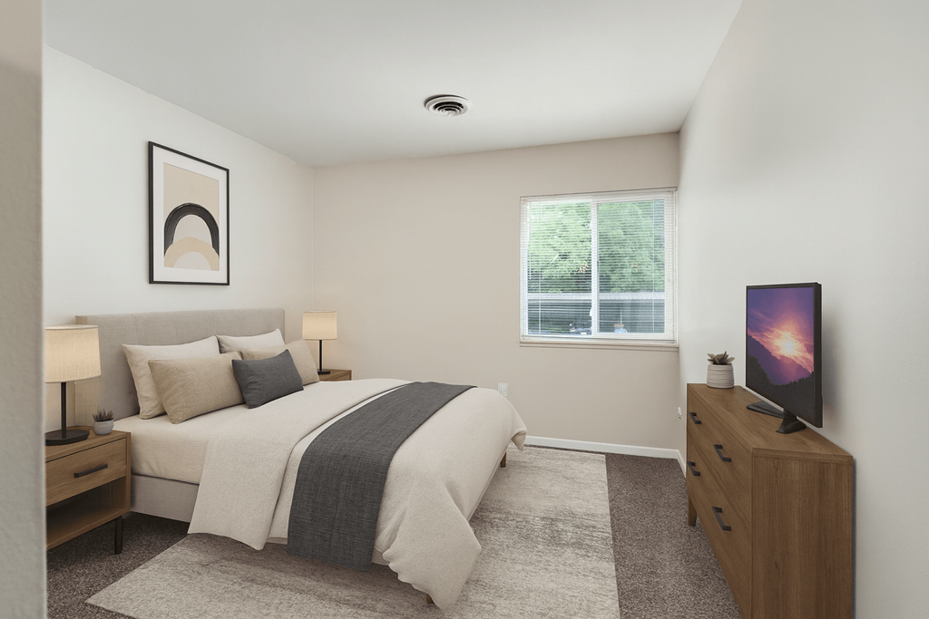 A bedroom with a bed, nightstand, and a television.