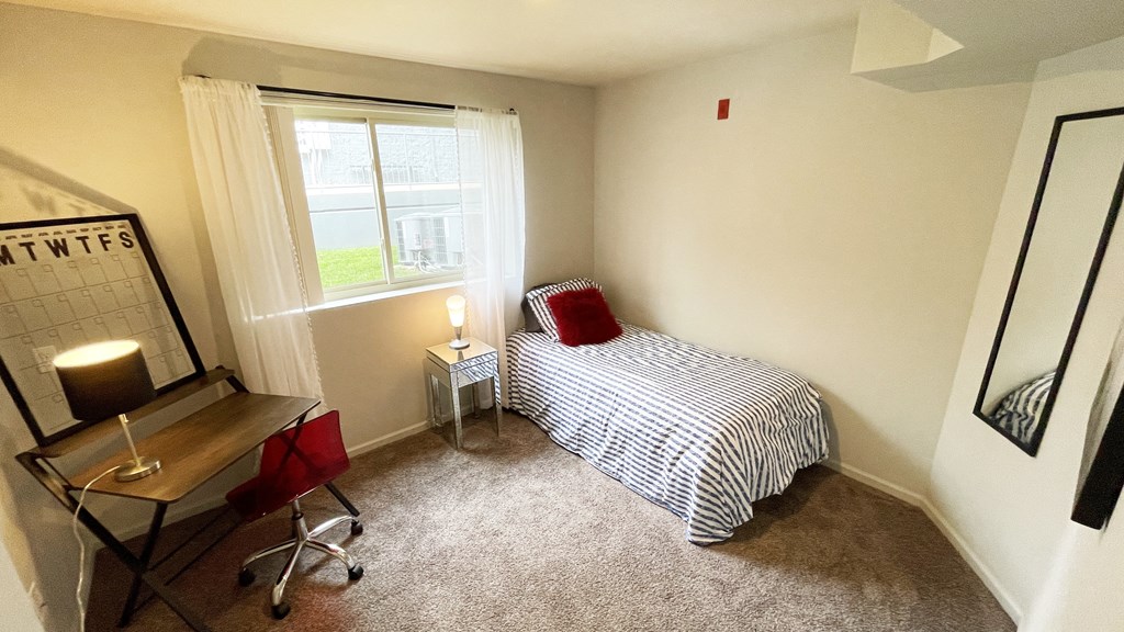 Spacious bedroom in East Lansing Apartments near Michigan State University | Cedar Greens