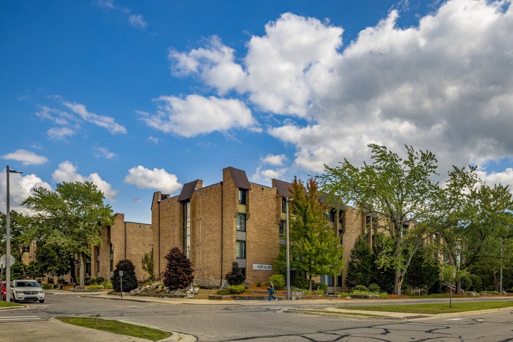 a large brick building on the corner of a street