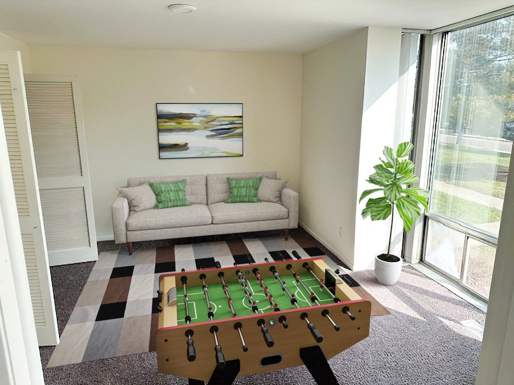 a living room with a pool table and a couch