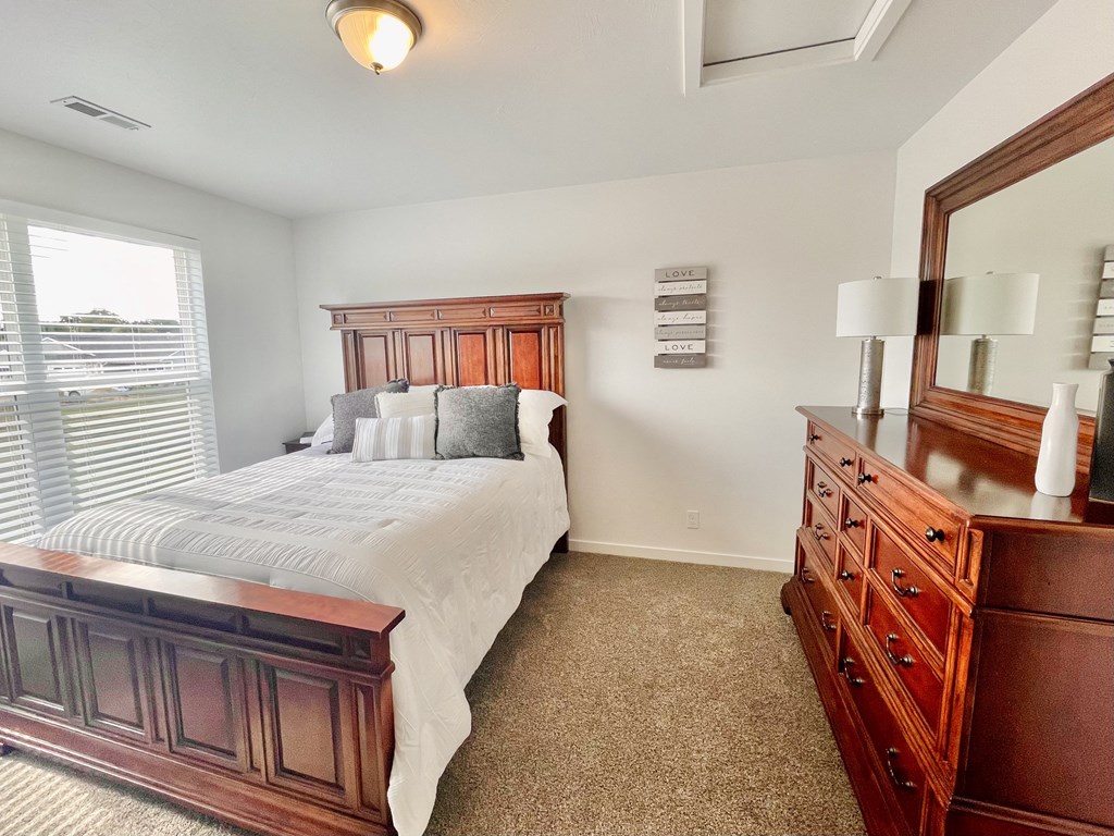 Bedroom in townhome at Elmwood Lake Apartments in Hudsonville MI