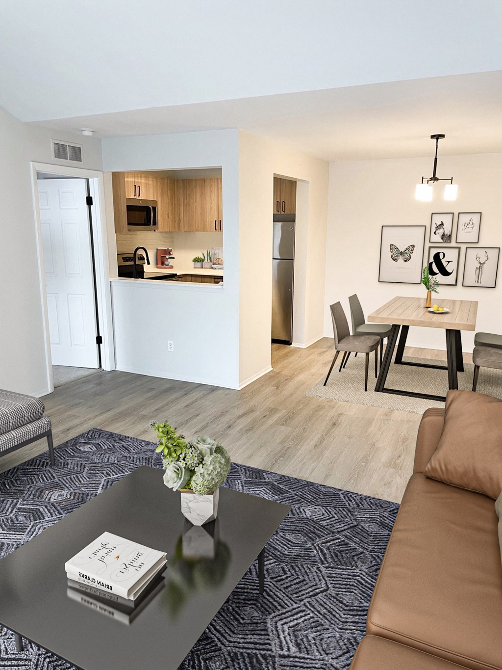a living room and dining room in a two bedroom apartment