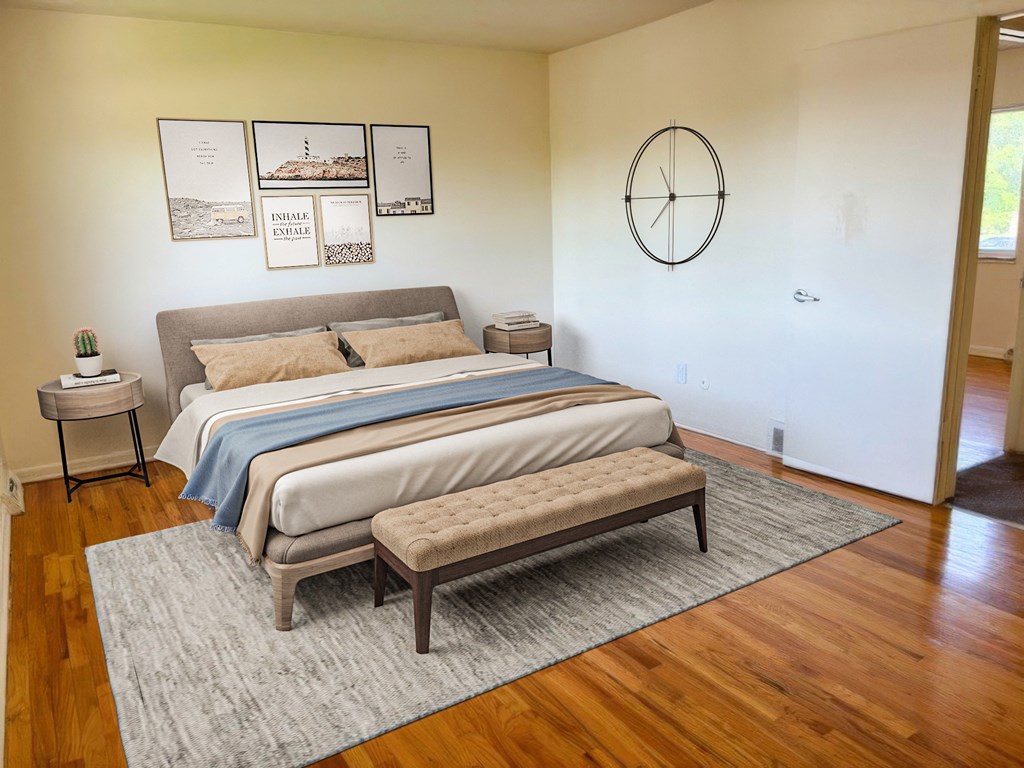 a bedroom with a bed and a clock on the wall