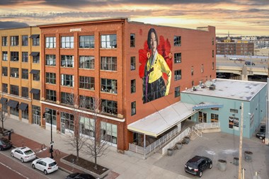 a mural of a woman on the side of a building
