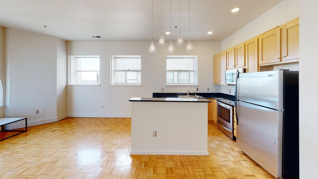 a kitchen with an island in the middle of the room