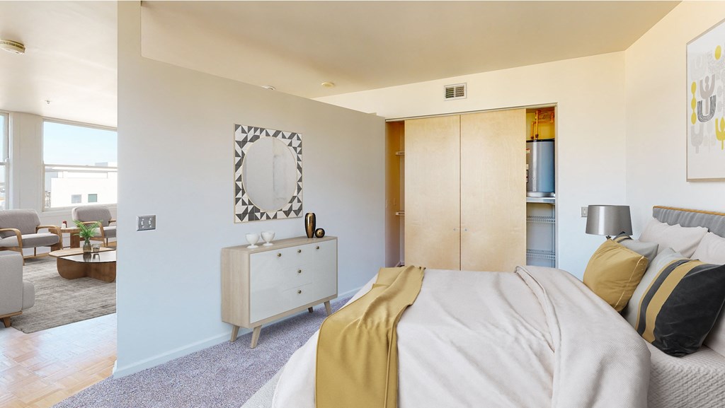 a bedroom with a bed and a dresser