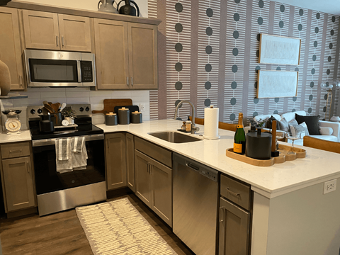 A kitchen with a stove top oven and a dishwasher.