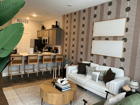 A living room with a white couch and a coffee table.