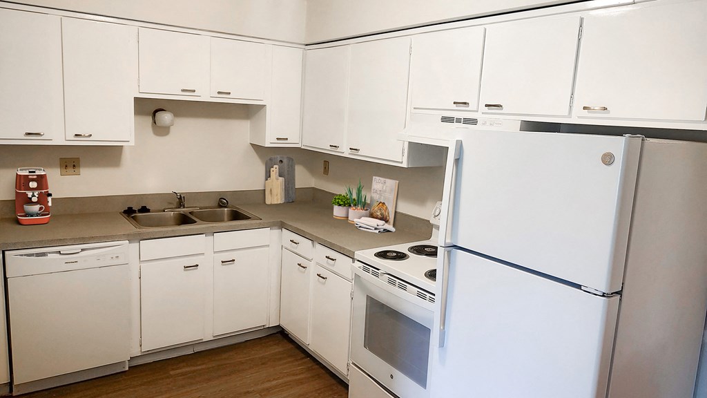 White gourmet kitchen in Okemos Village Apartments in Okemos, MI