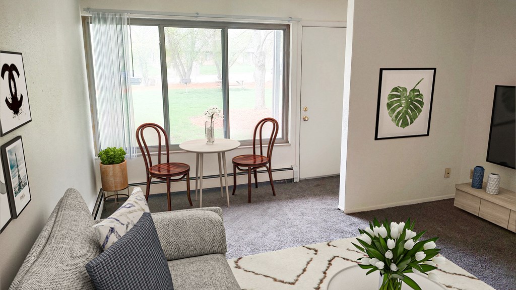 Living room and dining in Okemos Village Apartments in Okemos, MI