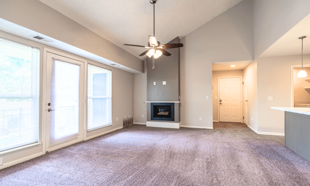 Renovated Open living room at Pine Lane Estates Apartments in Lansing, MI