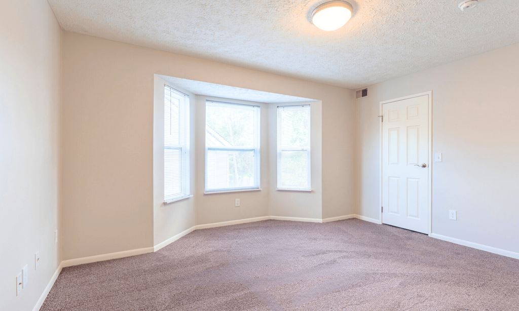 Spacious bedroom in Lansing Apartments | Pine Lane Estates near Eastwood Towne Center