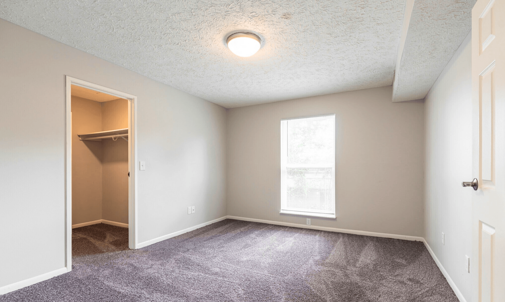 Spacious bedroom in Lansing Apartments | Pine Lane Estates near Eastwood Towne Center