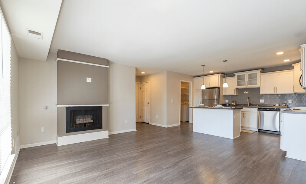 Renovated Open living room at Pine Lane Estates Apartments in Lansing, MI