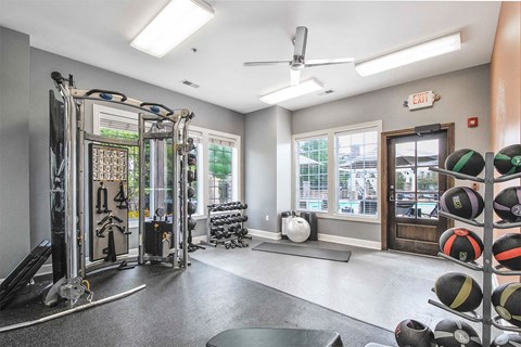 a home gym with a treadmill and weights