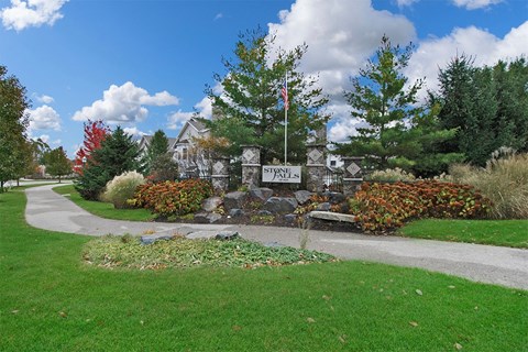 a home with a sign that says stanley in front of it