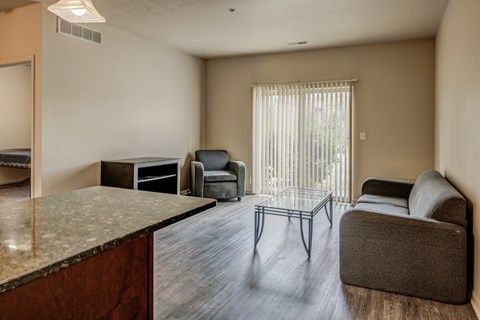 Kitchen and living room at Waterbury Place Apartments in East Lansing near Michigan State University