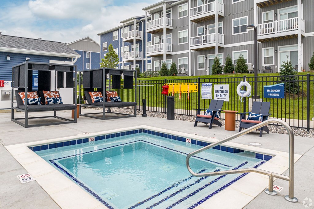 Pool, hot tub and pool deck at apartments in Traverse City | Bayview of Traverse City