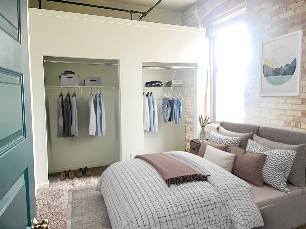 a bedroom with a bed and a closet