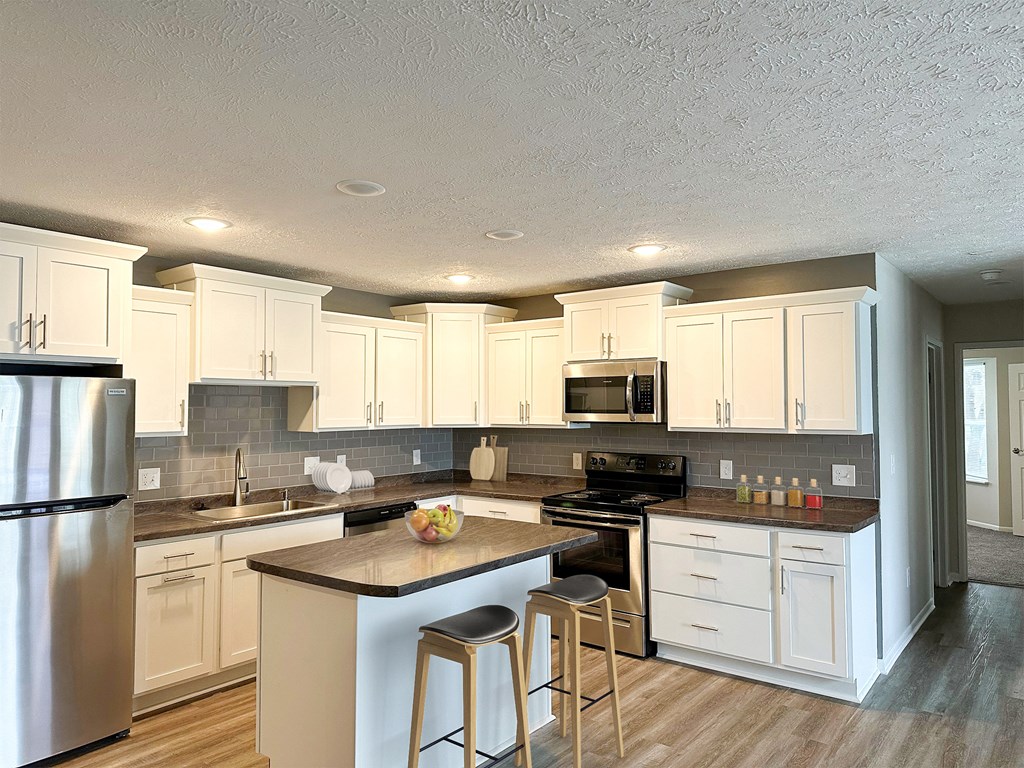 Open concept kitchen at Pine Lane Estates Apartments in Lansing, MI