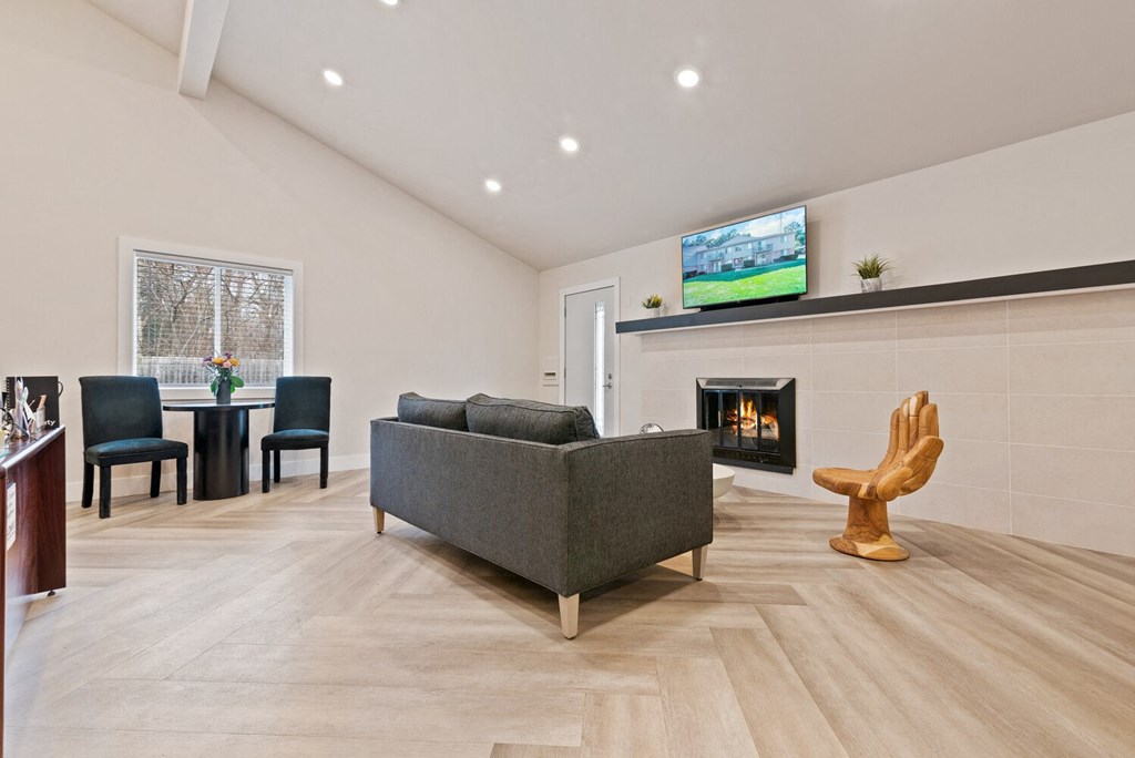 a living room with a couch and a fireplace