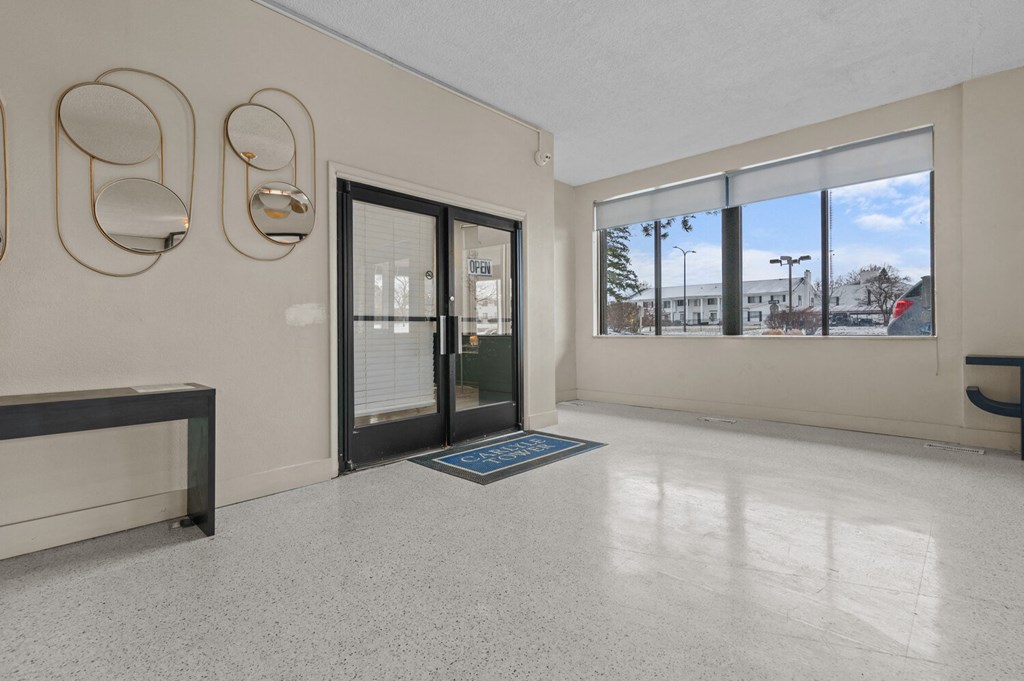 the preserve at ballantyne commons living room with glass doors and windows