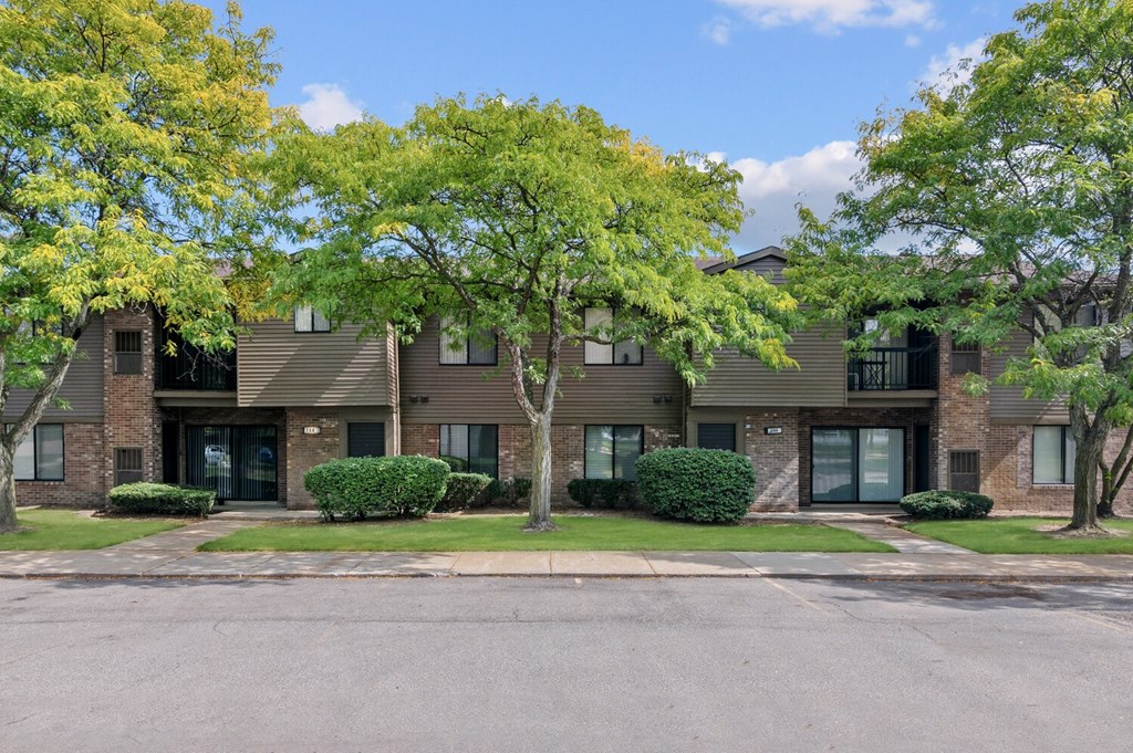 our apartments are located in a quiet neighborhood with trees and grass