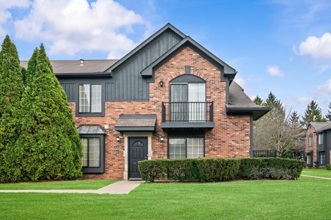 A large house with a black door and windows.