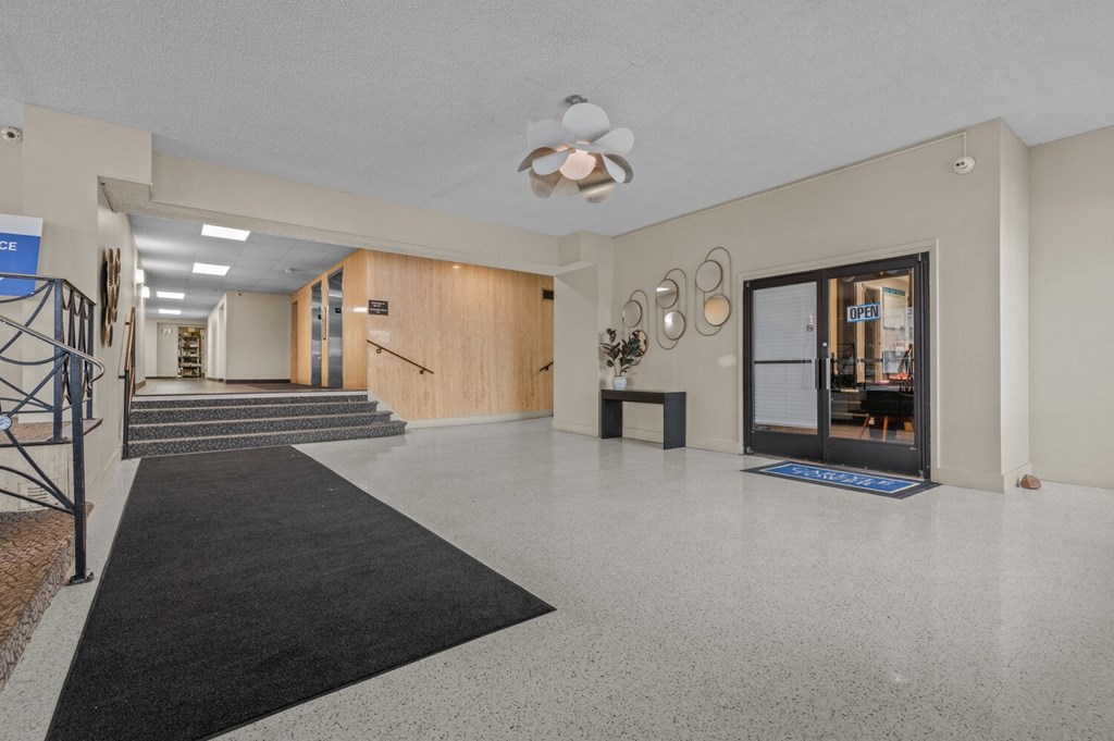 the preserve at ballantyne commons lobby with carpeted flooring and glass doors