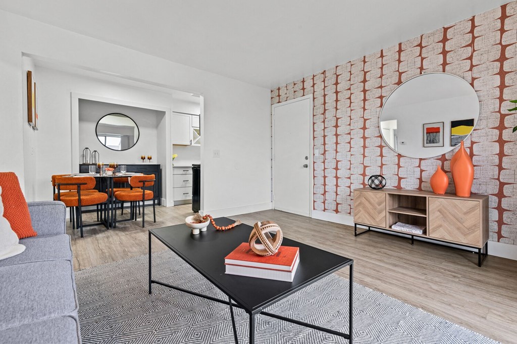 a living room with a couch and a coffee table  at Park On Canal Apartments, Clinton Twp, Michigan