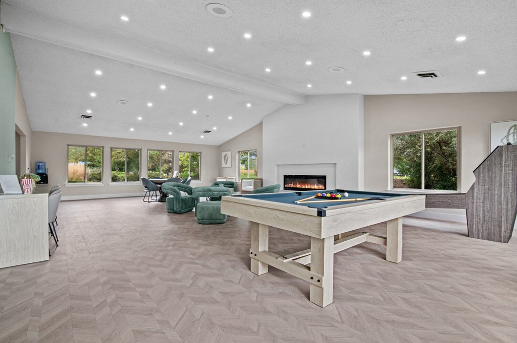 a game room with a pool table and a fireplace at Edge At Farmington Hills - Farmington Hills, MI, Michigan, 48334