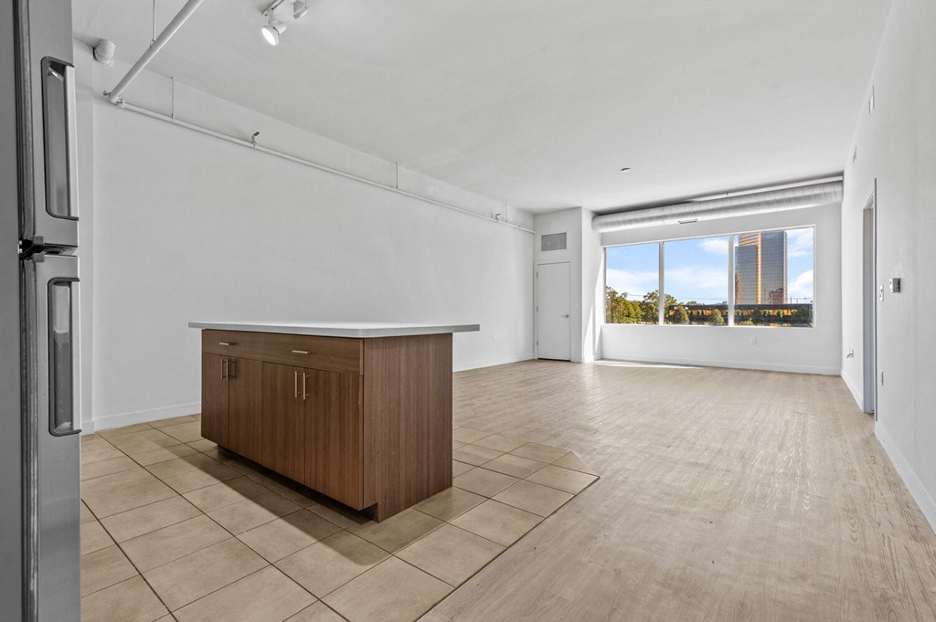 a kitchen and living room with a large window