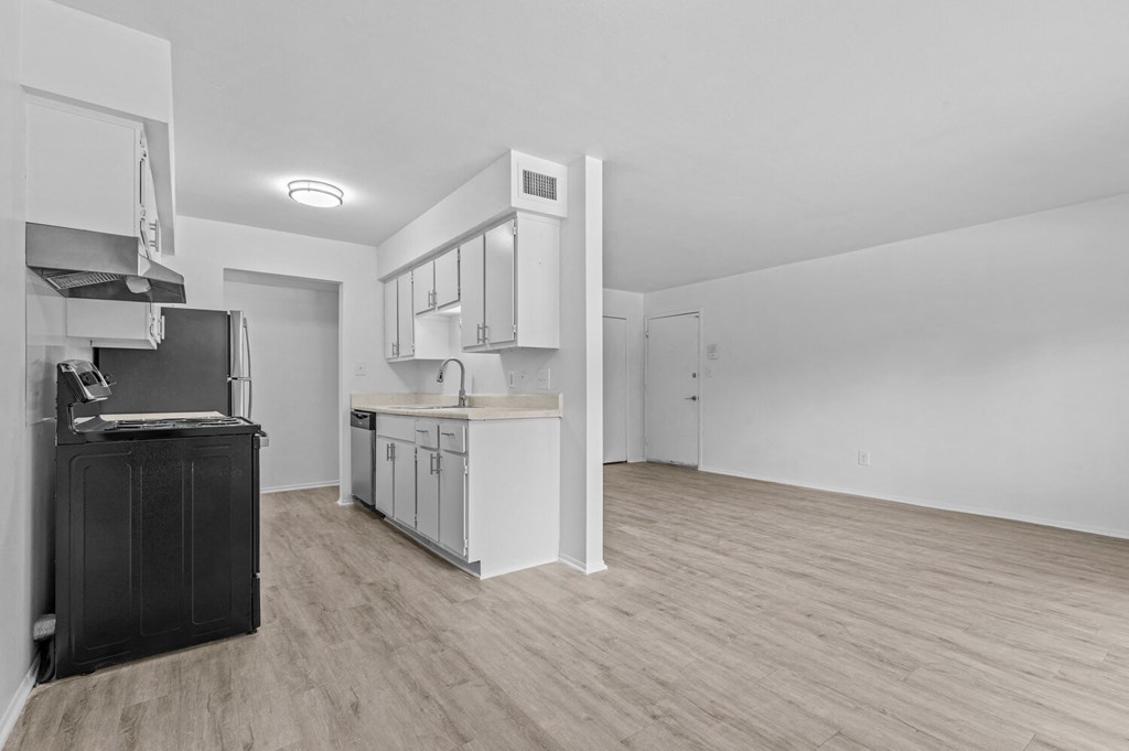 a kitchen and living room in a 555 waverly unit