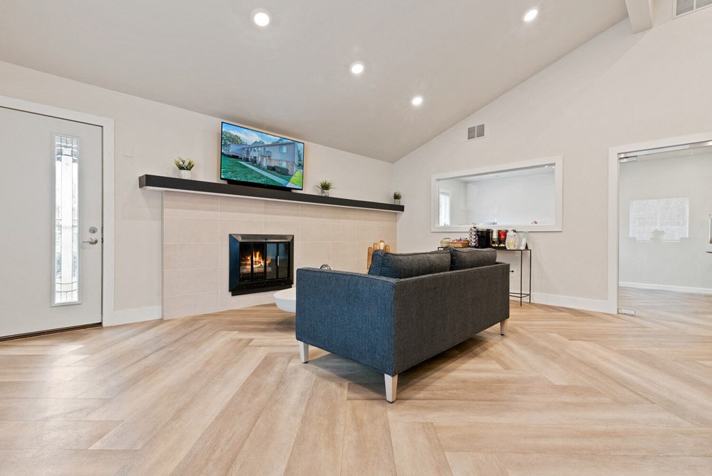a living room with a fireplace and a couch